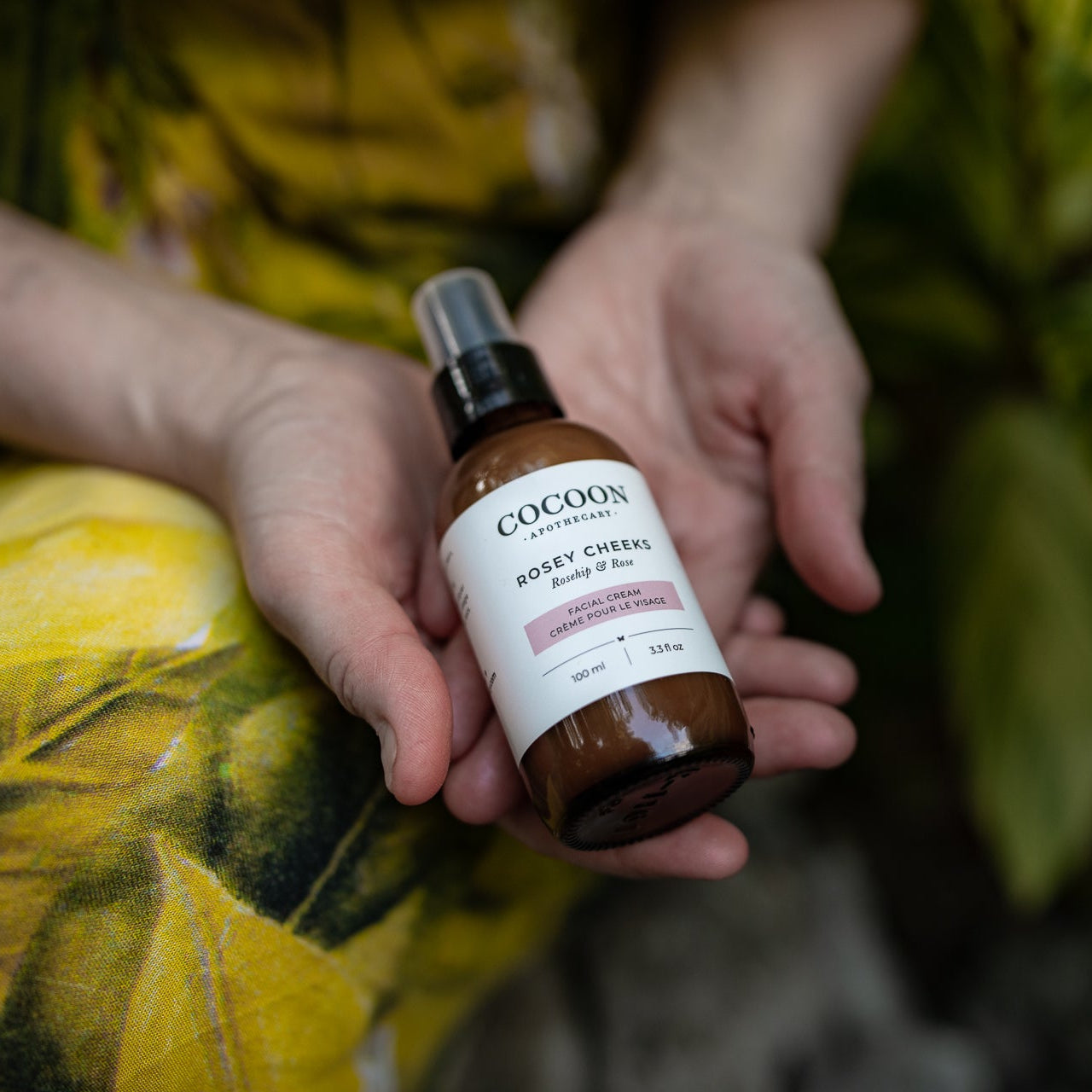 Eco-friendly glass bottle of Cocoon Apothecary Rosey Cheeks Facial Cream – vegan, Canadian-made, and recyclable packaging.