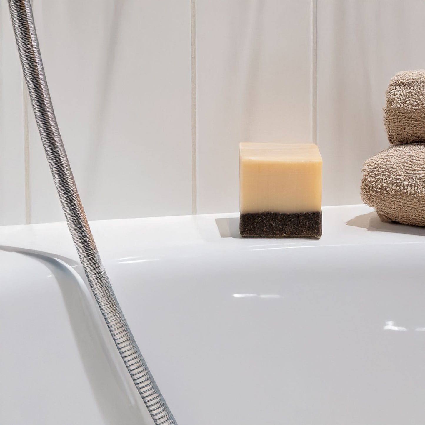 Coffee scrub soap on a bath tub