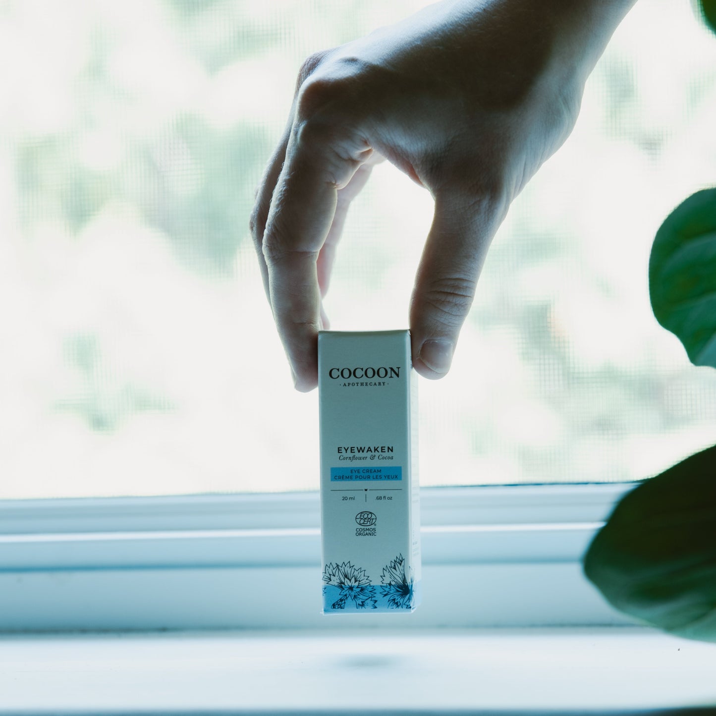 Eyewaken eye cream in a window