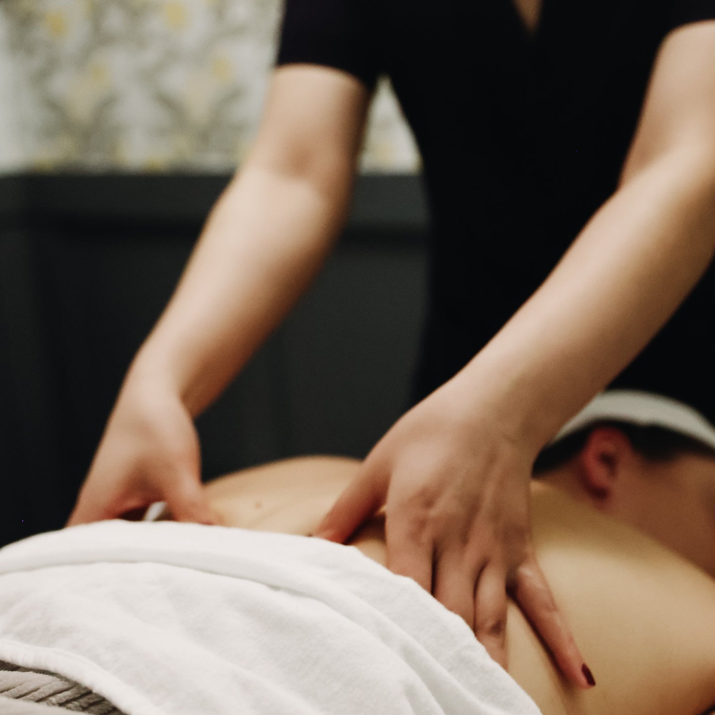 Person receiving a massage with a blurred background