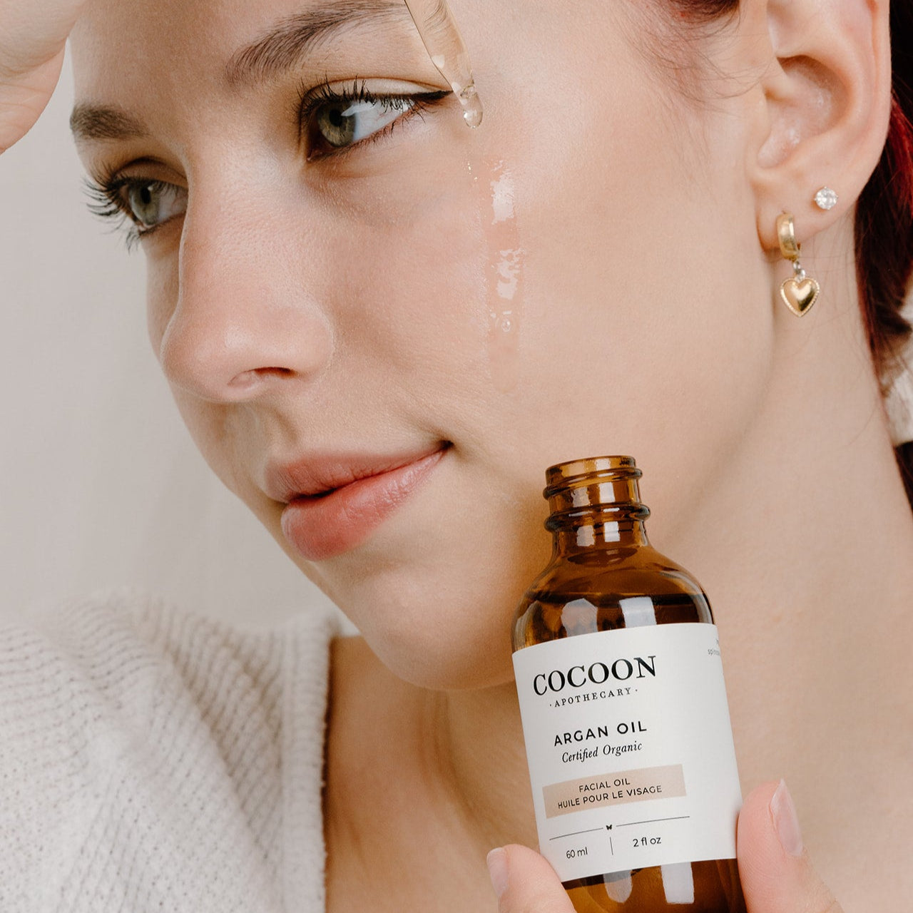 Using Argan Facial Oil on face for hydration and glow