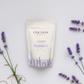 Cocoon Apothecary lavender bath salt packaging with lavender flowers on a light background