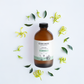 Cocoon Apothecary bottle with ylang ylang flowers and leaves