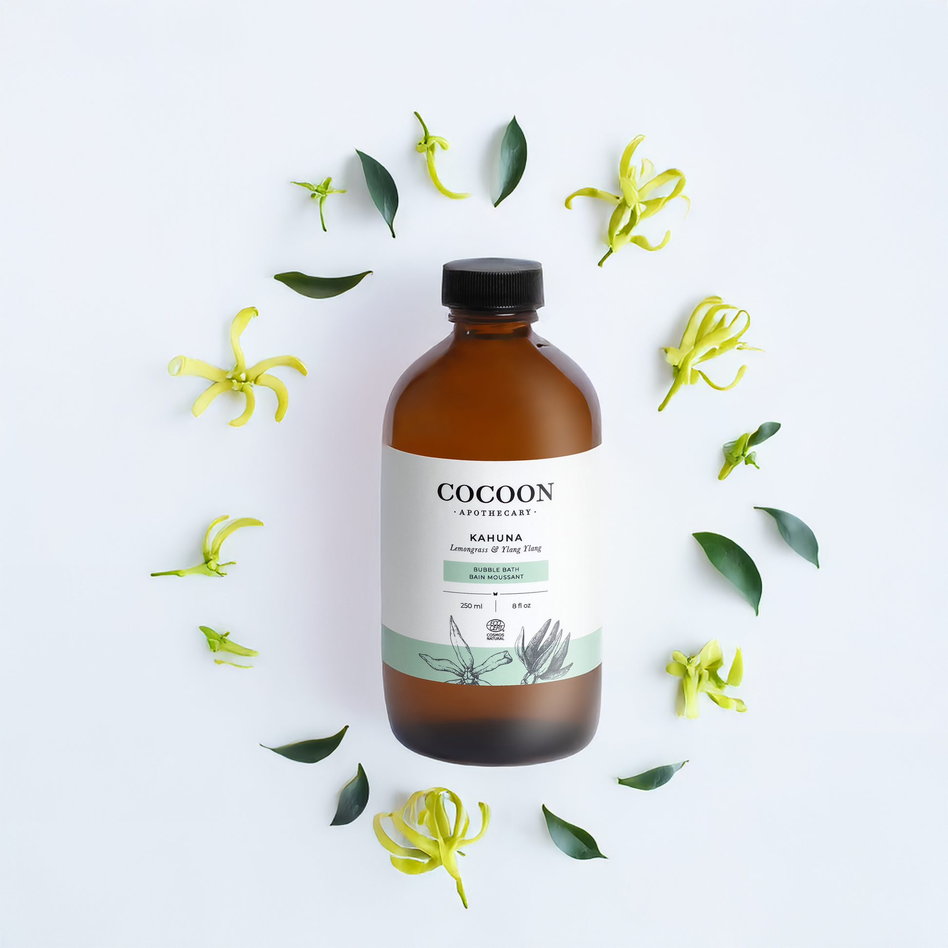 Cocoon Apothecary bottle with ylang ylang flowers and leaves