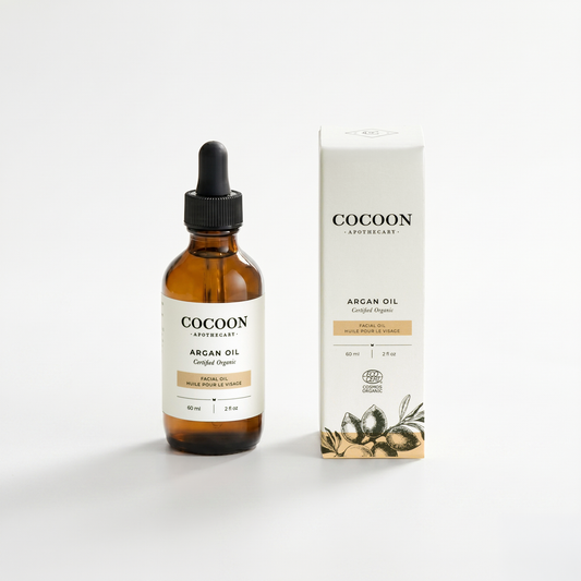 Cocoon Apothecary argan oil bottle and packaging on a white background