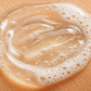 close up of skin with hand soap on it - clear gel with suds