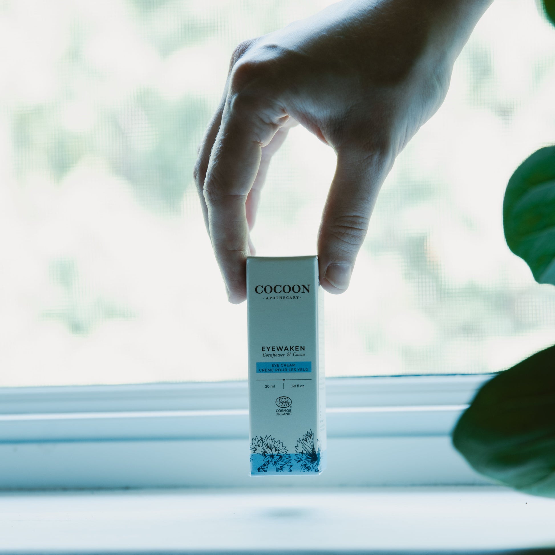 Eyewaken eye cream in a window