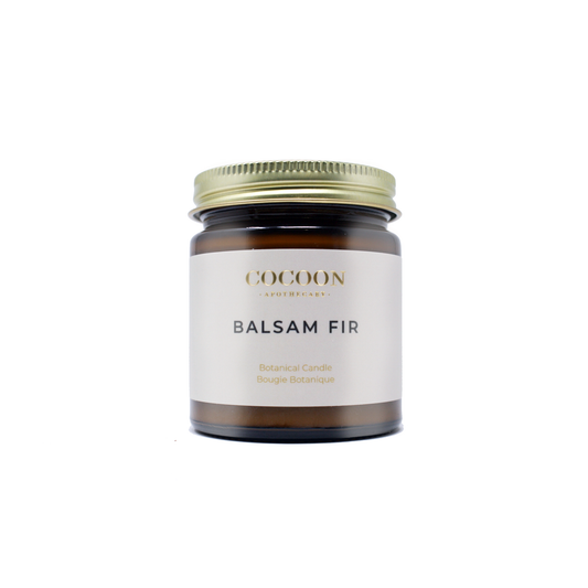 Candle jar labeled 'Balsam Fir' by 'Cocon' on a white background