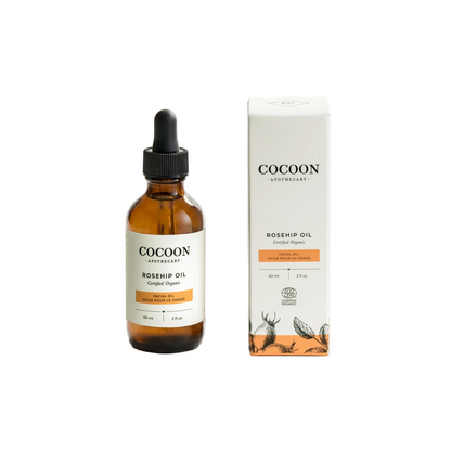 Cocoon Apothecary Rosehip Oil bottle and packaging on a white background