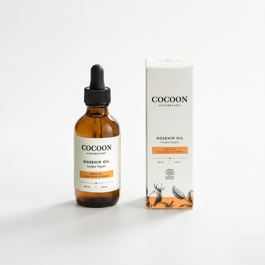 Cocoon Apothecary Rosehip Oil bottle and packaging on a white background