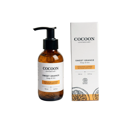 Cocoon Apothecary Sweet Orange skincare product with pump bottle and packaging on a white background