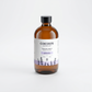 Brown bottle of Cocoon Apothecary product on a white background