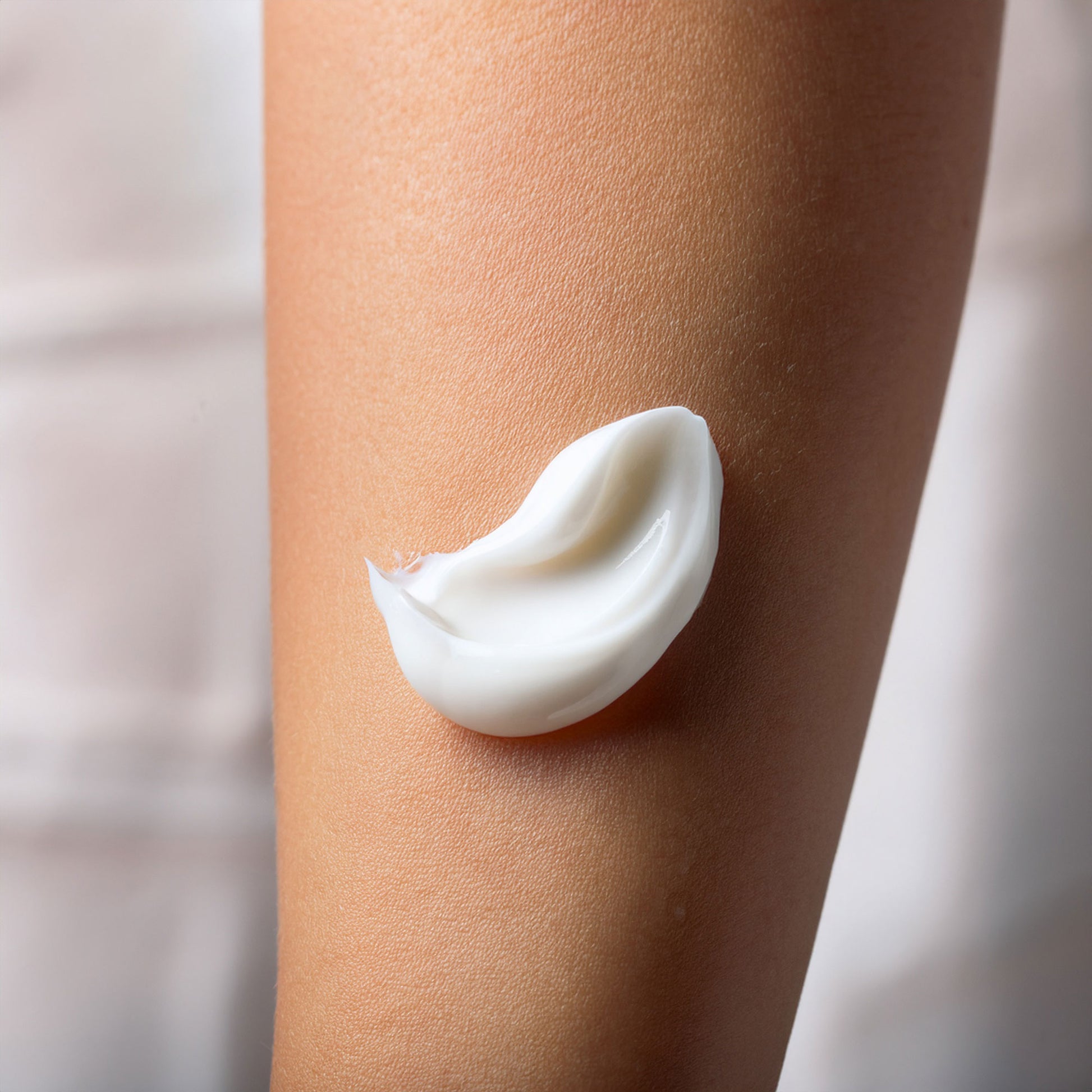 Close-up of Kahuna Body Lotion glass pump and label highlighting Ecocert certification and sustainable packaging.